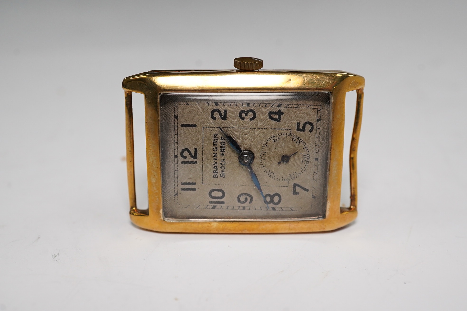 A gentleman's 9ct gold rectangular dial, manual wind wrist watch, retailed by Bravington, case diameter 26mm, no strap. Condition - poor to fair